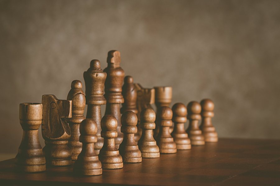Wooden chess pieces on a board
